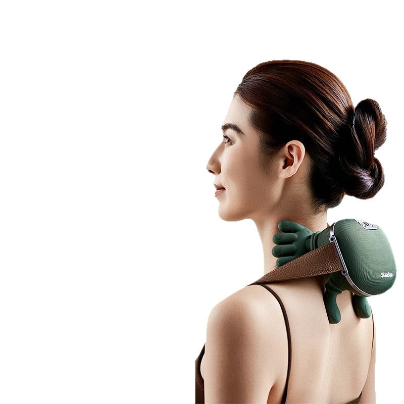 Woman using a green neck and shoulder massager 