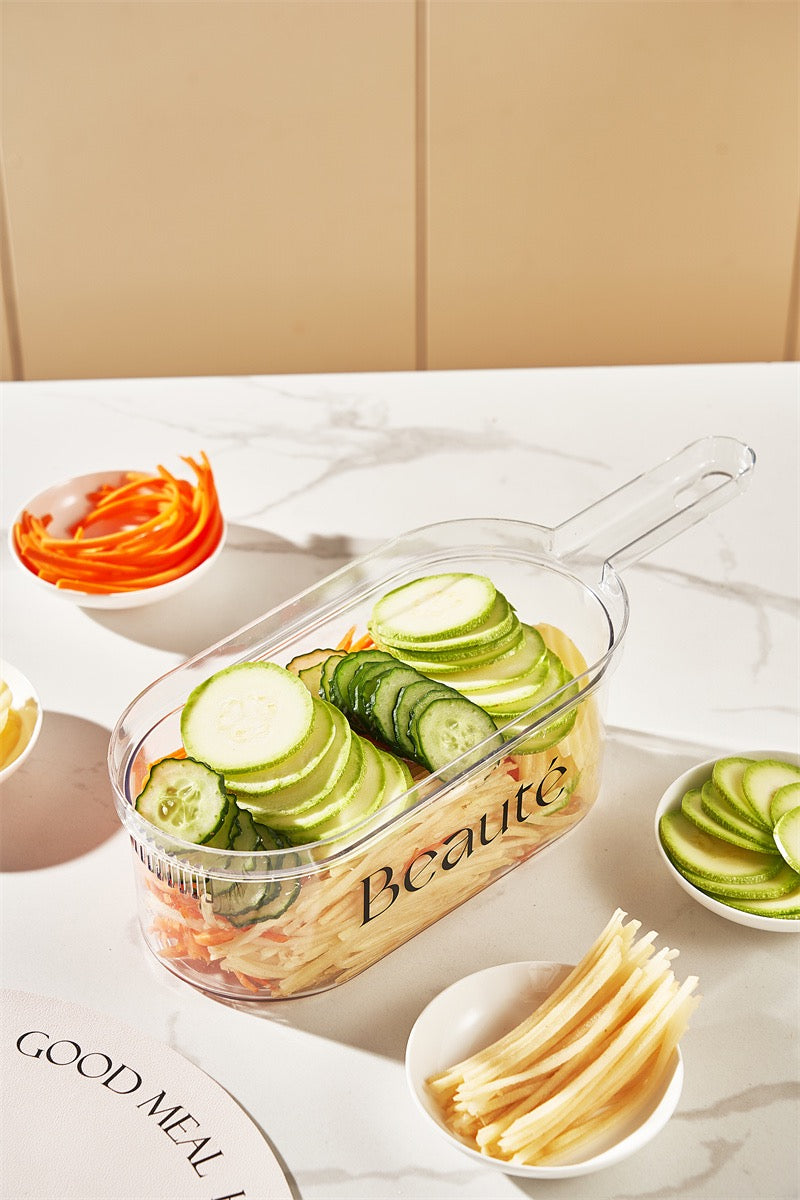 Clear glass container with sliced cucumbers on a marble surface with other vegetables.