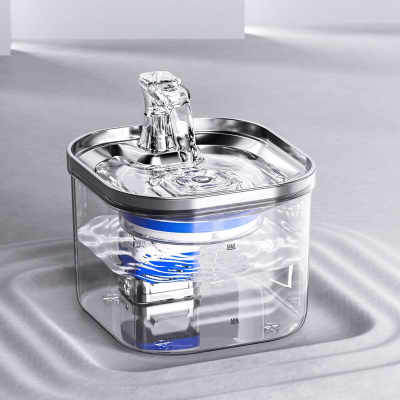 Clear pet water fountain with blue light on a gray background