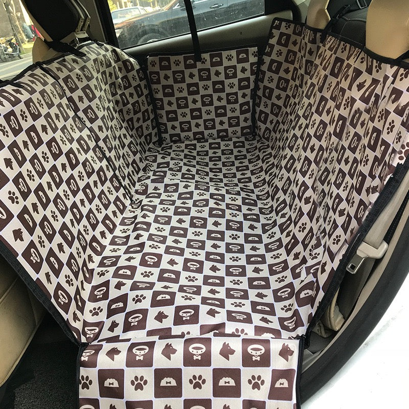 Car seat cover with dog pattern inside a vehicle