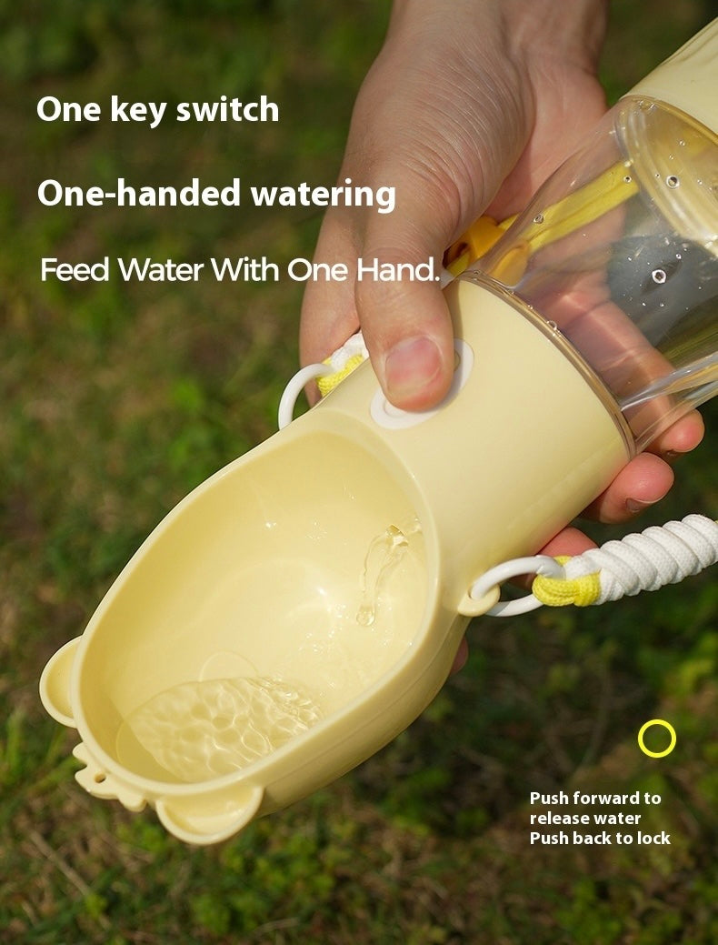 Hand holding a beige pet water bottle with text highlighting features on a grassy background