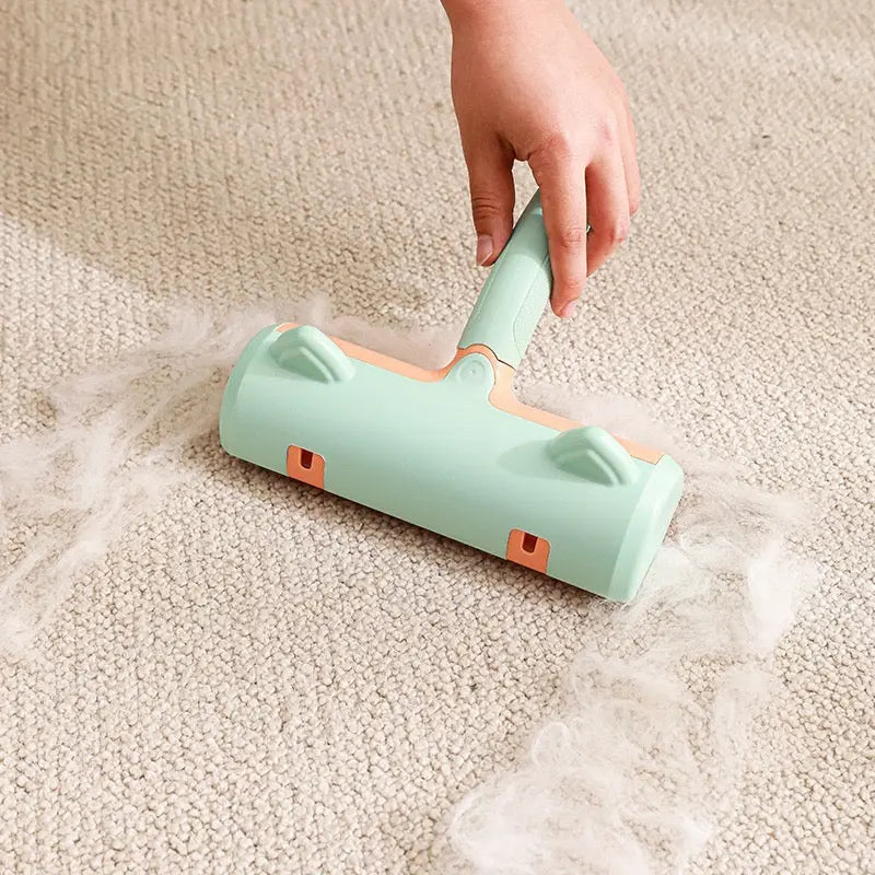 Green and orange cleaning tool being used on a carpet