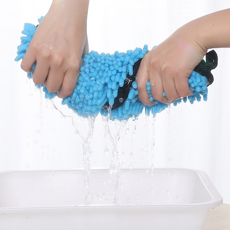 Blue pet towel being squeezed 