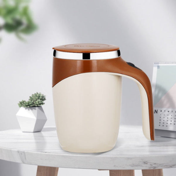 White and brown mug with a handle on a marble surface