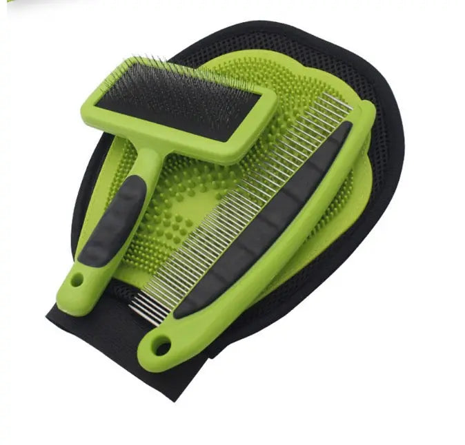 Green and black pet grooming brush on a white background