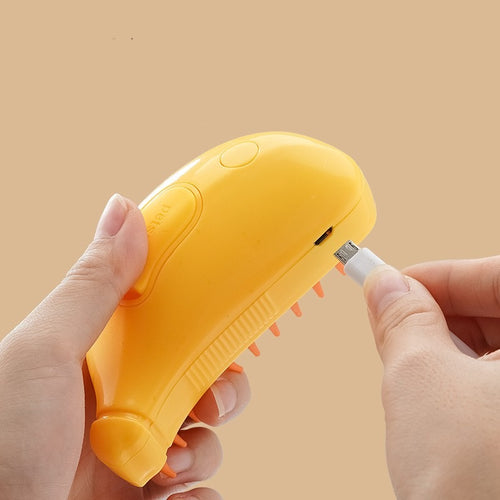 Yellow electronic device with a USB cable being inserted on a beige background